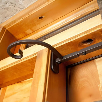 Wooden door with a metal handle and strap