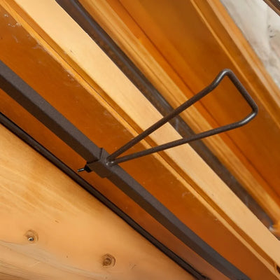 Metal door handle on a wooden door