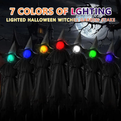 Lighted Halloween witches garden stake with colorful lights against a dark background.